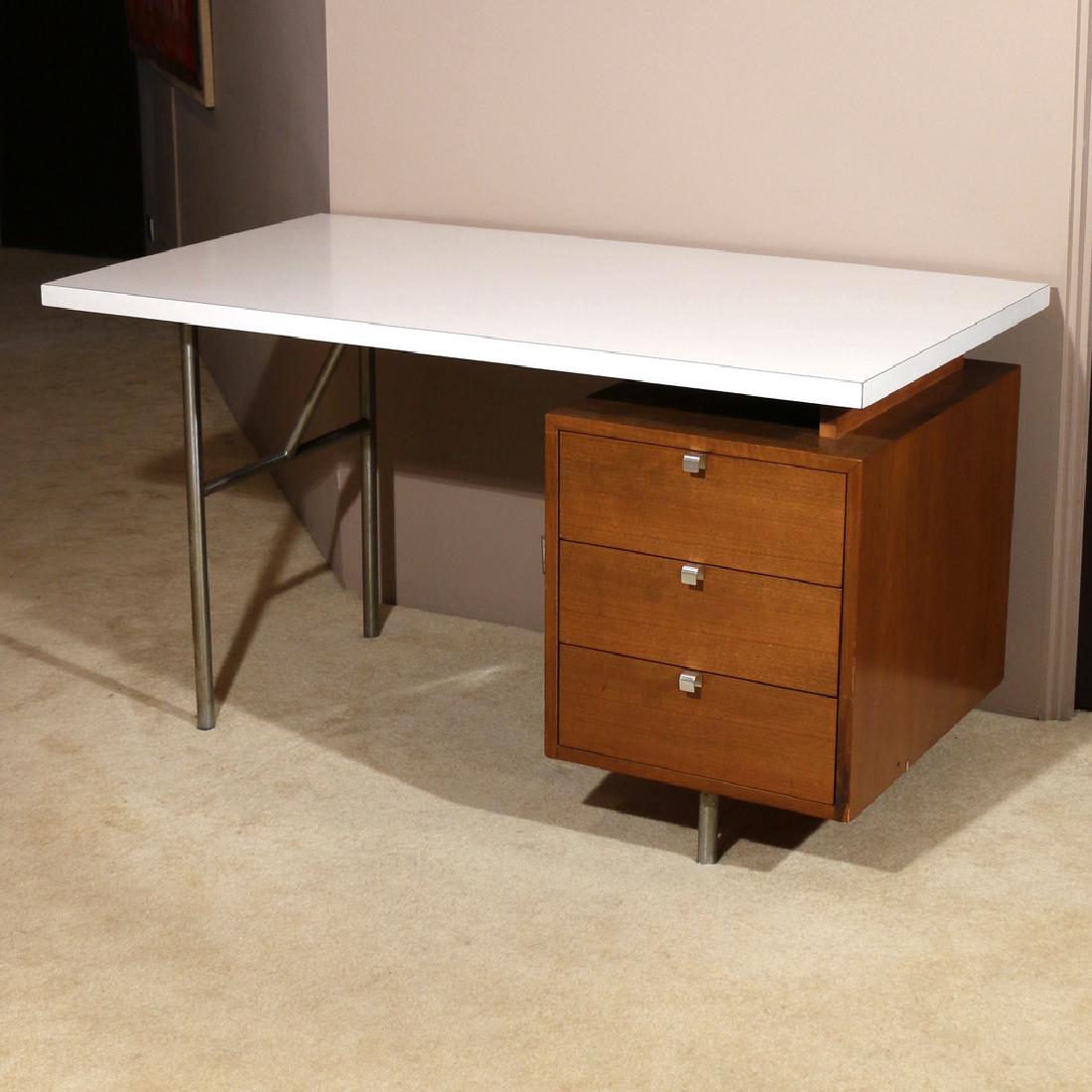 GEORGE NELSON FOR HERMAN MILLER DESK: with laminate top and bank of three drawers, with metal tag on drawer interior h. 29-1/2 w. 54 d. 30 in.