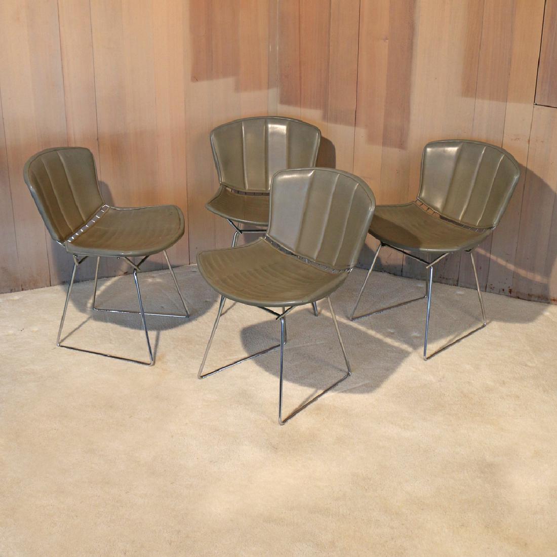 (4pc) BERTOIA FOR KNOLL INTERNATIONAL WIRE CHAIRS: with original grey leather upholstery, Knoll International labels under seat h. 29 w. 21 d. 24 in. Condition: padding under seats deteriorating and taped