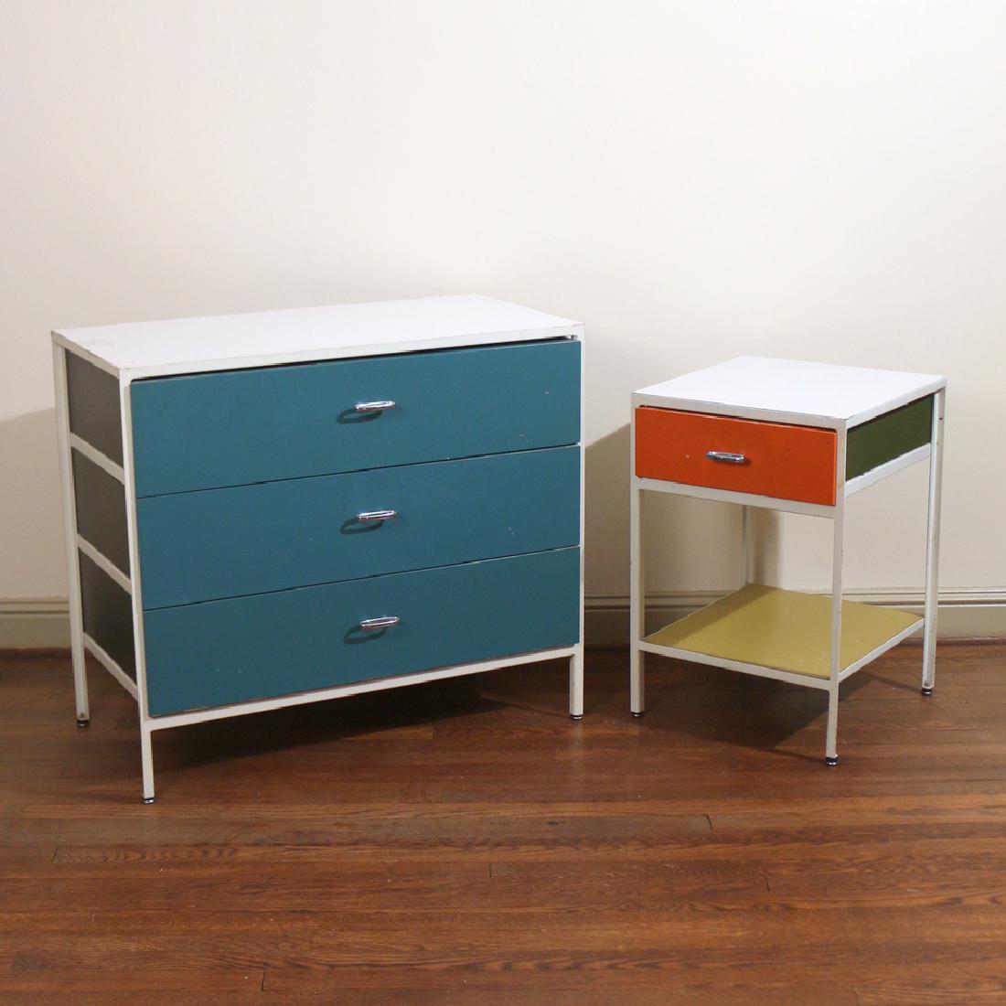 (2pc) GEORGE NELSON FOR HERMAN MILLER FURNITURE: including a three-drawer chest, h. 29-1/2 w. 33-1/2 d. 17 in.; and a one-drawer side table with lower shelf, h. 24-1/2 w. 17 d. 17-1/2 in.; both with painted steel metal frames and wood drawers, the s