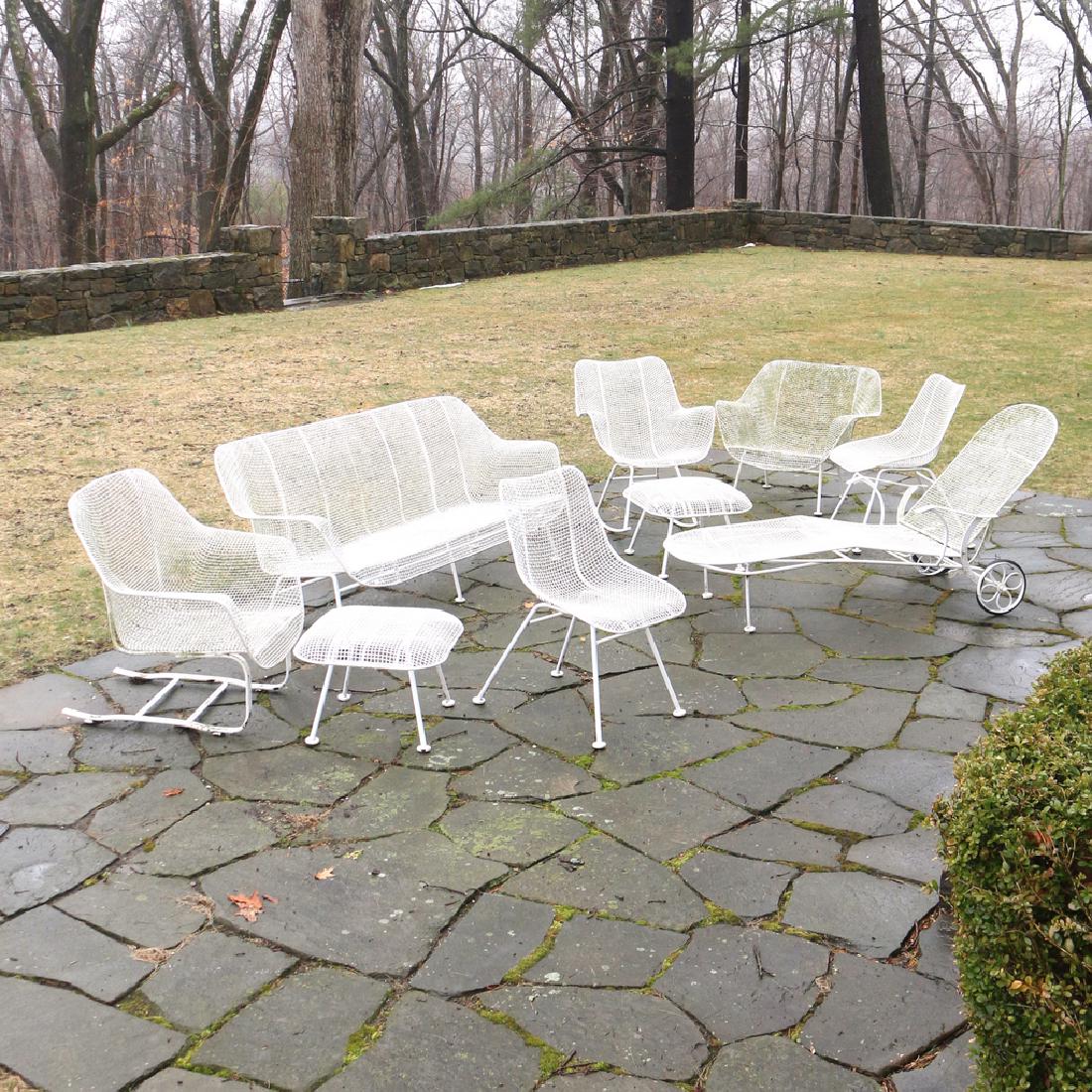 (9pc) MISC. RUSSEL WOODARD PATIO FURNITURE: enameled metal, including 1 settee, h. 28 w. 72 d. 29 in., 1 chaise lounge, 1 rocking chair, h. 32 in., 1 armchair, 1 L-shaped rocker, 2 side chairs, and 2 ottomans