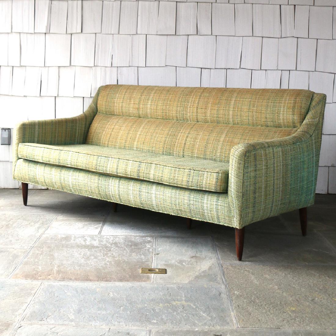 FABRY ASSOCIATES SETTEE: c. 1950s, with six walnut or rosewood legs h. 32 w. 70 d. 32 in. Condition: dried and faded upholstery