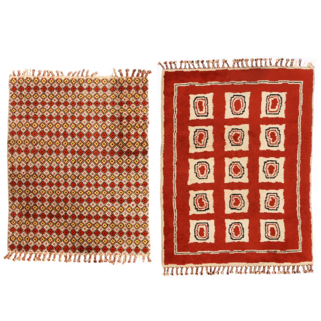(2pc) MOROCCAN CARPETS: including one with a lattice design in red, yellow, and white, 11ft x 7ft-8in.; and one with three rows of white blocks on a red ground, 13ft x 9ft
