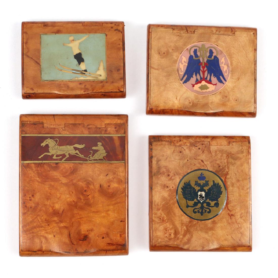 (4pc) RUSSIAN INLAID BURL WOOD CIGARETTE BOXES: all inlaid in brass and various other materials h. 4-1/4 w. 3-1/4 in. (largest) Provenance: By descent through a New Canaan, CT family