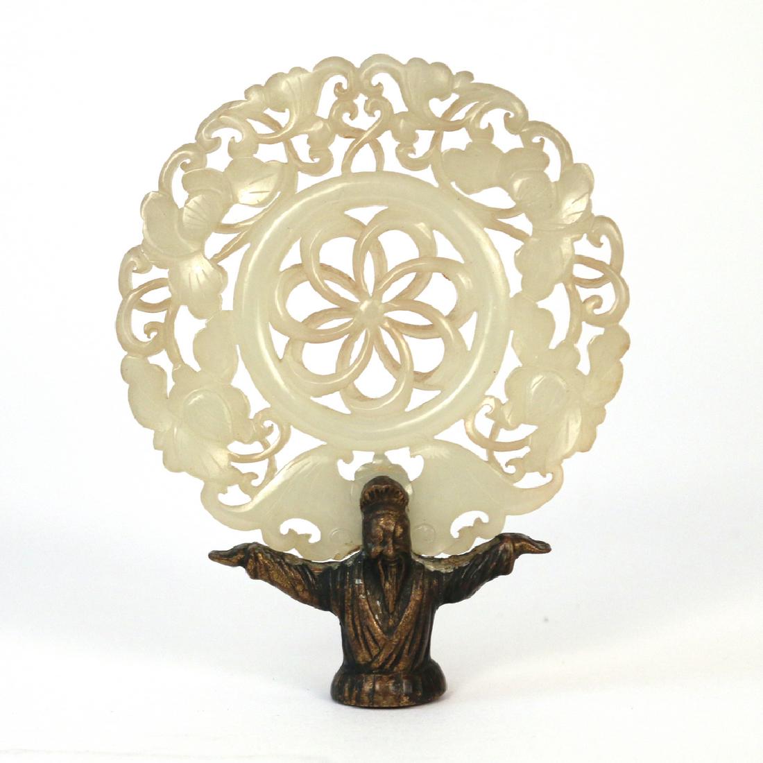 CARVED JADE DISC FINIAL: Mounted as a finial held up by a bronze scholar, dia. 3 in., h.3-3/4 in