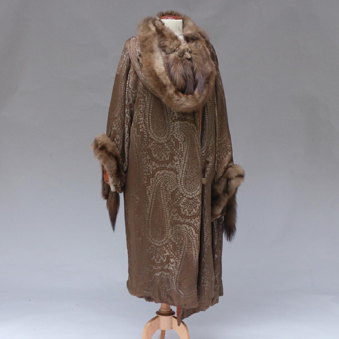 PAISLEY LAMÉ EVENING COAT: trimmed with sable fur, marked S. Moritz" appx. L. 49 in. Provenance: Estate of the late Elizabeth Luther, N.Y.C. proceeds to be donated to Old Sturbridge Village Museum, Sturbridge, MA"