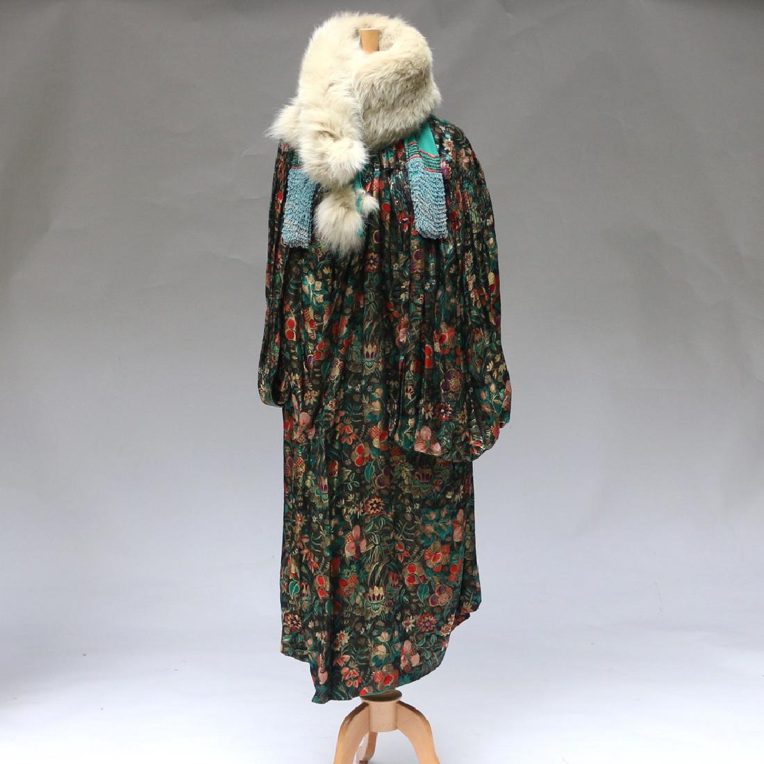 FLORAL LAMÉ EVENING COAT: With an accompanying fur scarf, marked S. Moritz", appx. L. 46 in. Provenance: Estate of the late Elizabeth Luther, N.Y.C. proceeds to be donated to Old Sturbridge Village Museum, Sturbridge, MA"