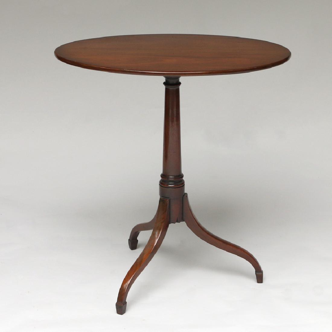 KITTINGER WILLIAMSBURG TILT TOP TEA TABLE: oval top, Williamsburg mark h. 27-1/2 w. 26 d. 18 in. Provenance: From a Riverside, CT estate