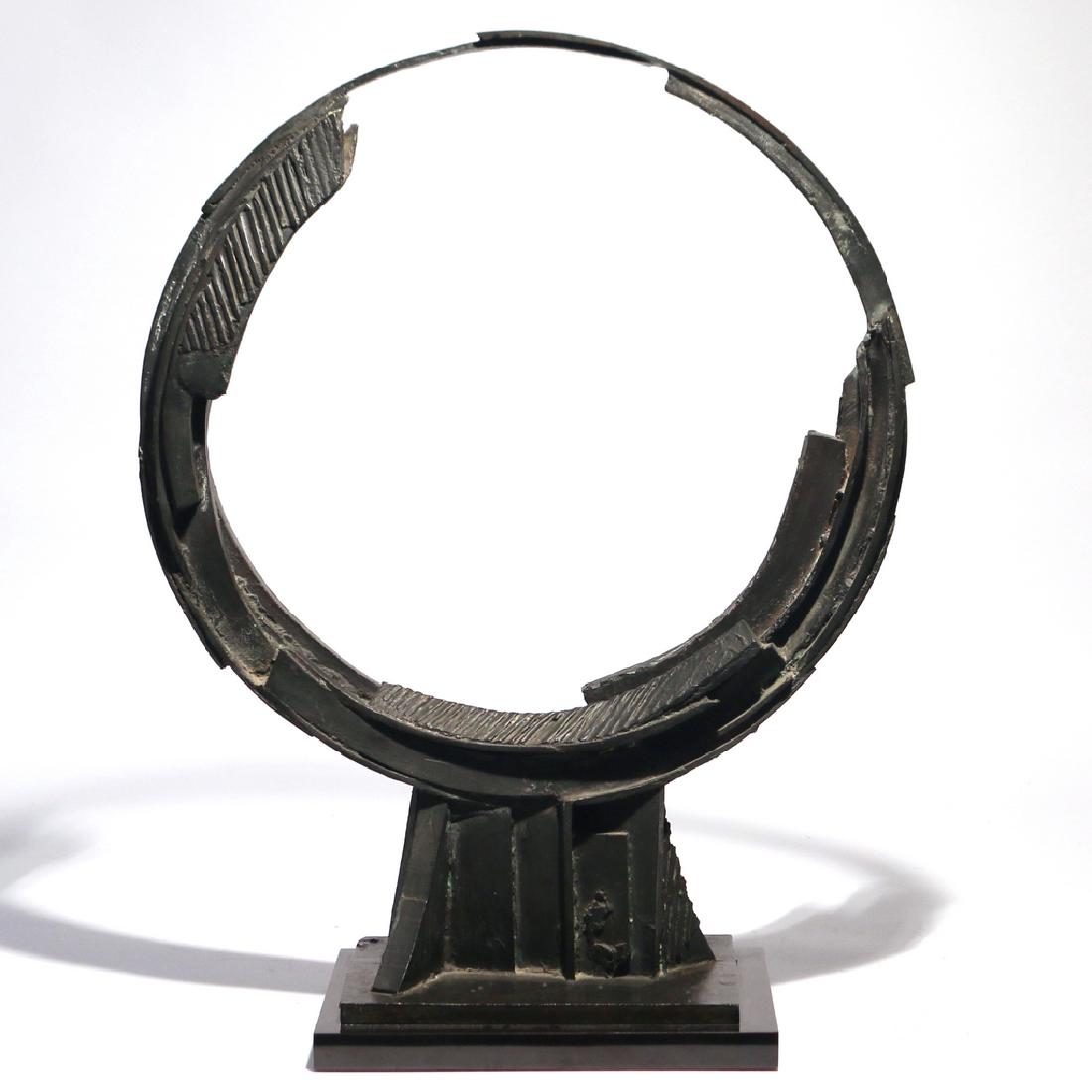 BRUNO ROMEDA (Italian, 1933-2017): Untitled (Circle), 1986 bronze h. 28-1/2 w. 21-1/2 d. 8-1/2 in. no apparent signature, mounted on a slate plinth, with xerox of Romeda's catalog photograph of the bronze inscribed 'ours' by consignor'