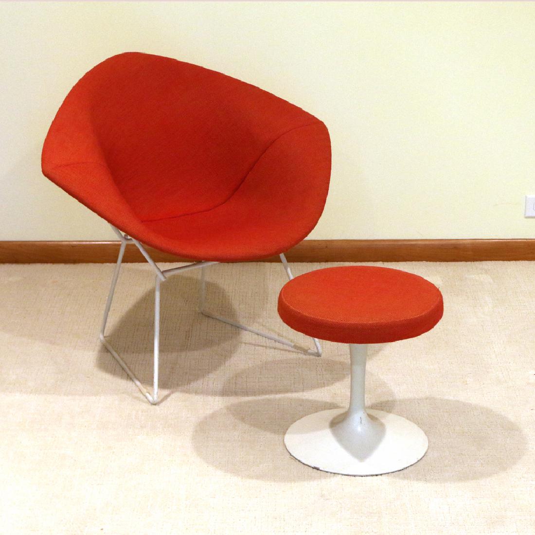 (2pc) KNOLL BERTOIA DIAMOND CHAIR: white enameled wire with red upholstery, Knoll Associates label, plus a Saarinen for Knoll round ottoman with matching upholstery, with Knoll label h. 30 w. 34 d. 29 in.