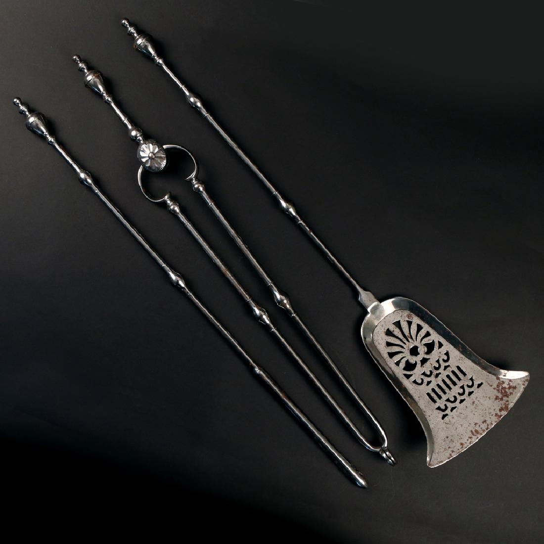 (3pc) SET REGENCY STEEL FIREPLACE TOOLS: early 19th Century, comprising a shovel, tongs, and poker, all with matching chased urn finials overall: 30-1/2 in. (shovel)
