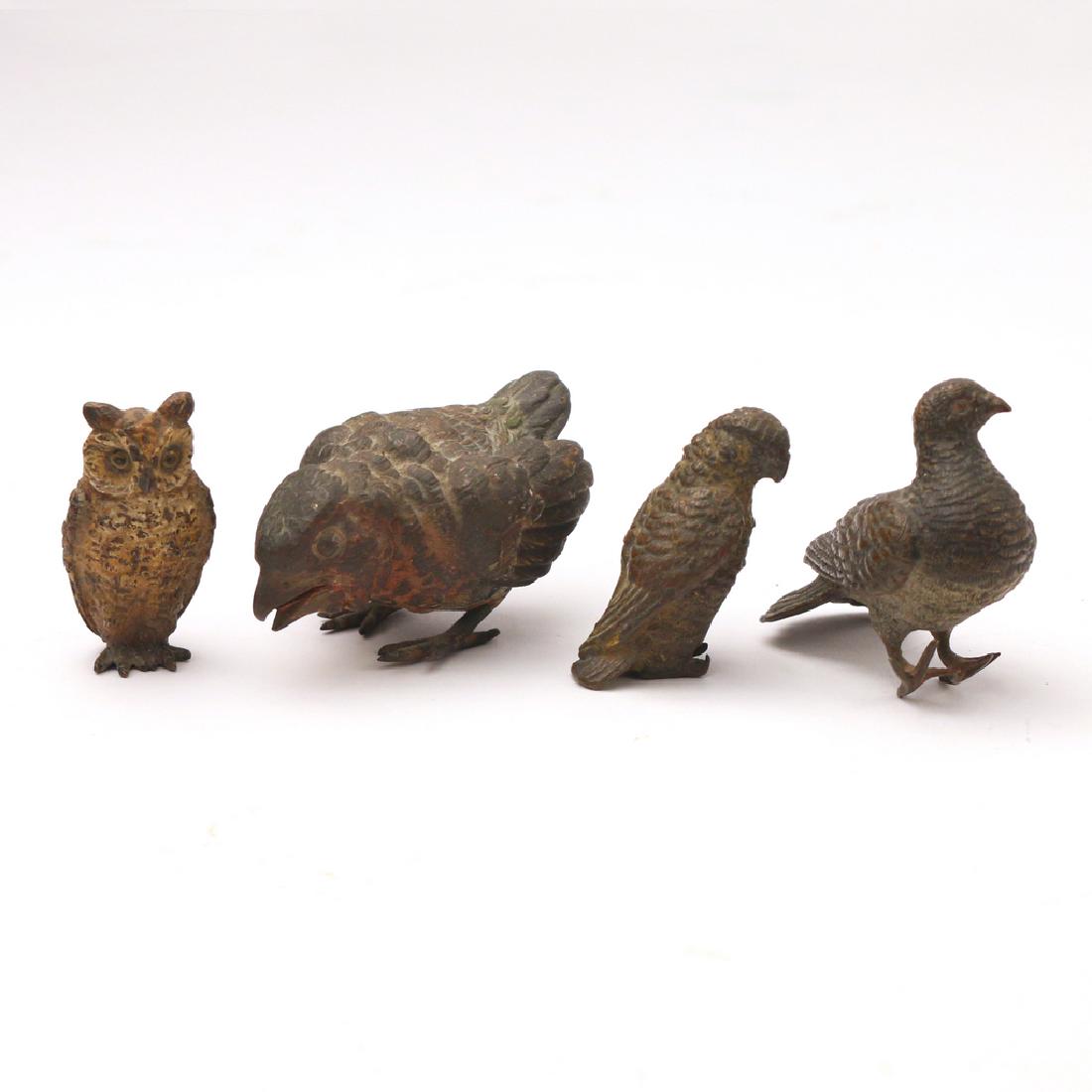 (4pc) COLD PAINTED MINIATURE BRONZE BIRDS: Including an owl, a bird of prey, a quail, a (possibly) young bird of prey; 3 with old traces of polychrome; height range: 1 to 1-1/2 in. Condition: Quail does not stand upright due to bent feet; othe