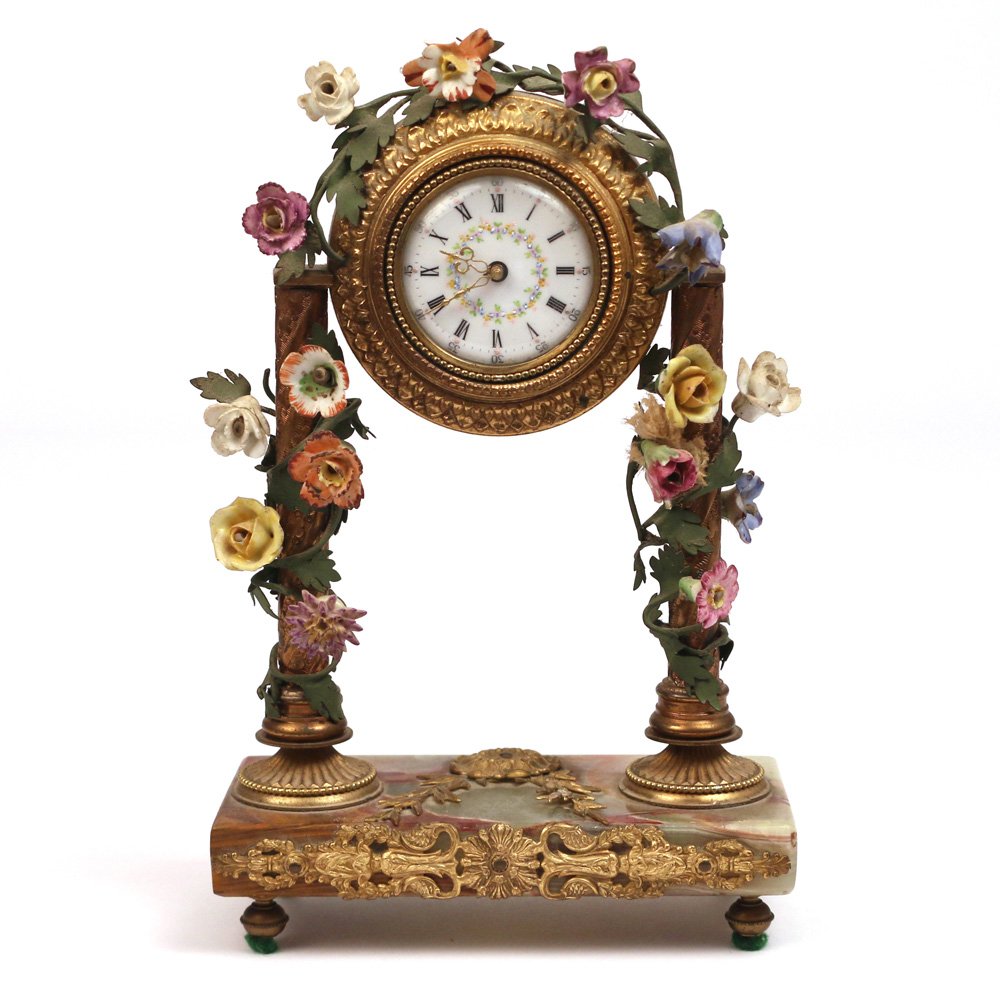 FRENCH ORMOLU & ONYX MANTLE CLOCK: late 19th/early 20th Century, with china-flower garlands h. 9 in.
