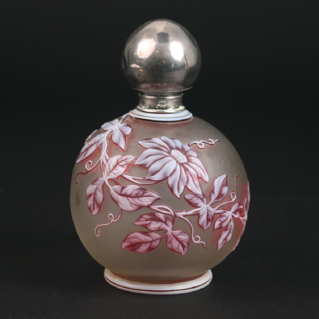 (ATTRIB) WEBB CAMEO GLASS PERFUME BOTTLE: early 20th Century, of globular shape, the frosted glass with flower and leaf cameo overlay in red and white, monogrammed sterling stopper h. 6 in. Condition: minor enamel loss, apears to be in excell