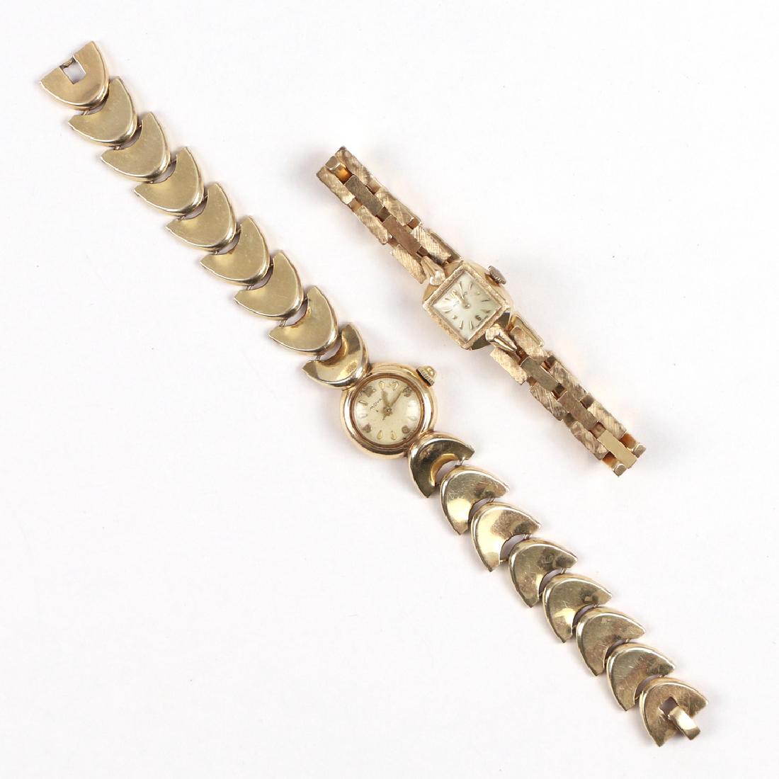 (2pc) MOVADO 14K GOLD LADY'S WRISTWATCHES: including one chevron-like links, 6-3/4 in., appx. 19g (without movement); and one with rectangular links, 16.1g (without movement)