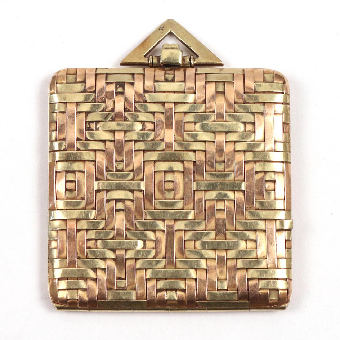 CARTIER 14K GOLD BRAIDED LOCKET: of square dimensions, marked 'Cartier' and '14k', 20.9g h. 2 w. 1-1/8 in. Condition: one strand coming up at edge