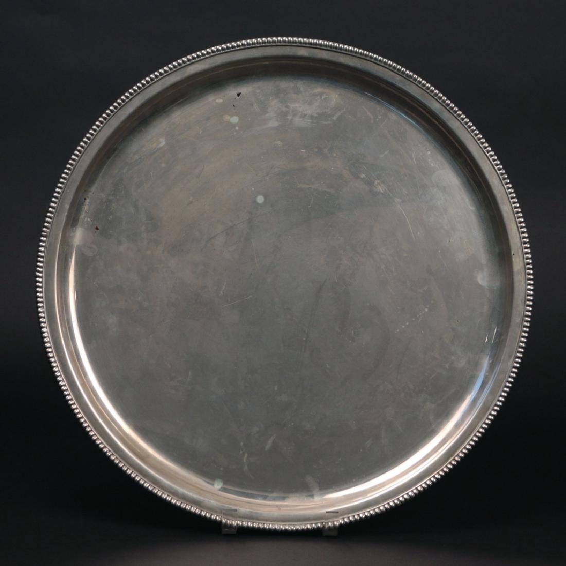 LARGE ROUND CONTINENTAL SILVER TRAY: Having a beaded edge, machined back, marked 800" with indistinguishable hallmark; dia. 18 in., 61ozt"