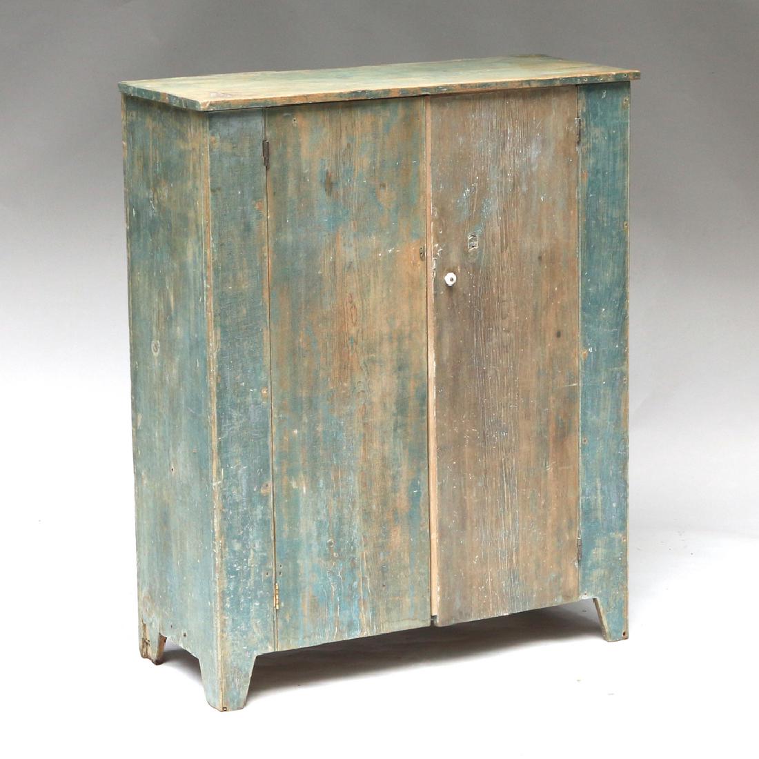 AMERICAN GREEN-PAINTED WALL CUPBOARD: 19th Century, with double doors enclosing five shelves, original paint h. 51-1/2 w. 42 d. 18 in. Provenance: historic Scofield Dairy Farm, Pound Ridge, N.Y. same family for generations Condition: orig