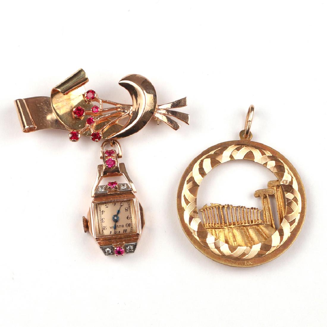 (2pc) GOLD PIN & PENDANT: Including a Bulova 14k gold ribbon-form pin suspending a pendant watch with melee diamonds and small rubies/ pink sapphires (l.2-1/4 in., 18.7g); and a circular 14k gold pendant with The Parthenon in