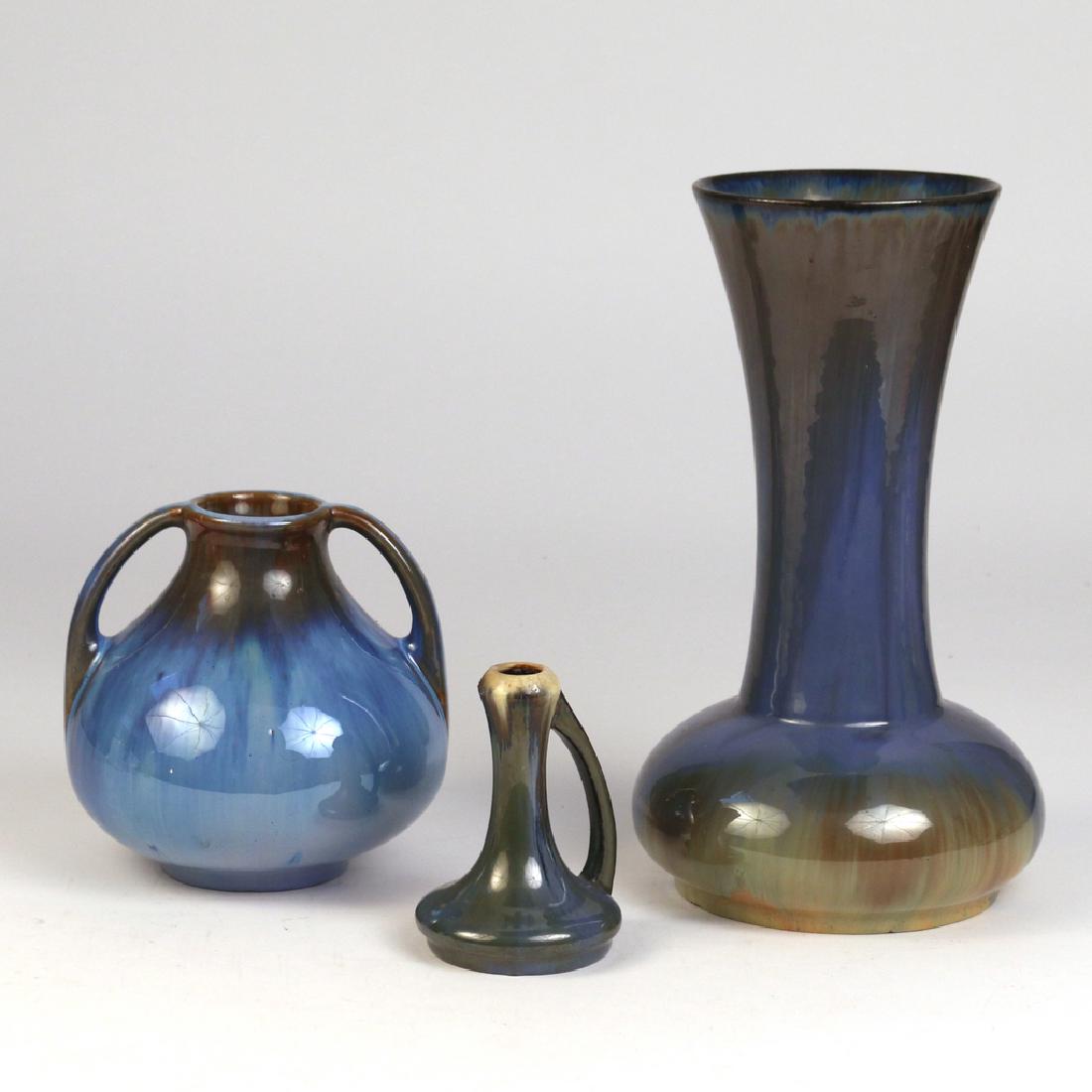 (3pc) FULPER POTTERY: all with blue flambe glaze, including a trumpet vase with bulbous base; a squat double-handle vase; and a single-handle bud vase h. 11-1/2 in. (tallest) Condition: tallest with flakes around foot