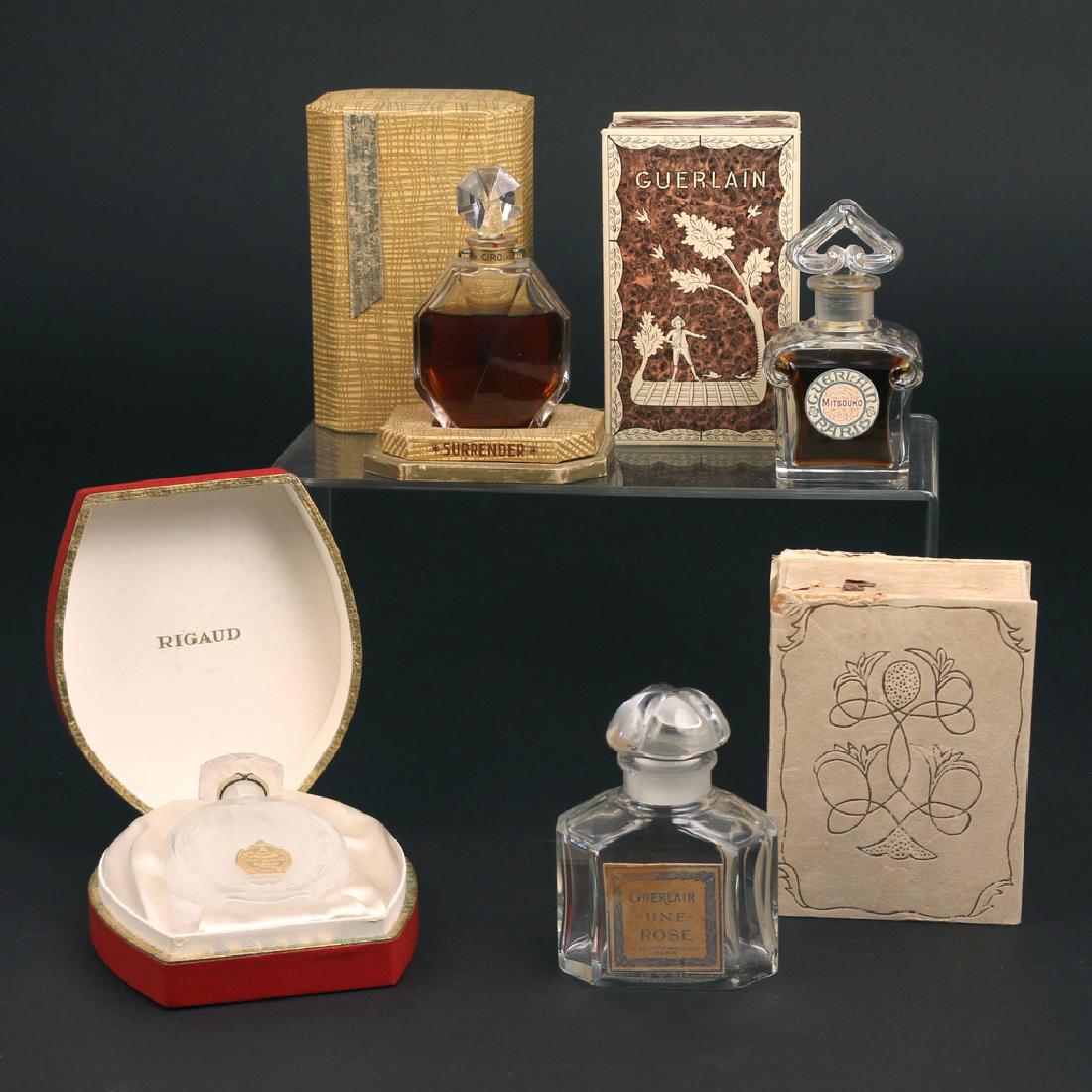 (4pc) FRENCH BOXED PERFUME BOTTLES: Including a Guerlain Mitsouko", baccarat crystal bottle in fitted box; a Guerlain "Une Rose", baccarat crystal bottle in fitted box, a Ciro "Surrender", baccarat crystal bottle (h.4-1/4in.) with fitte