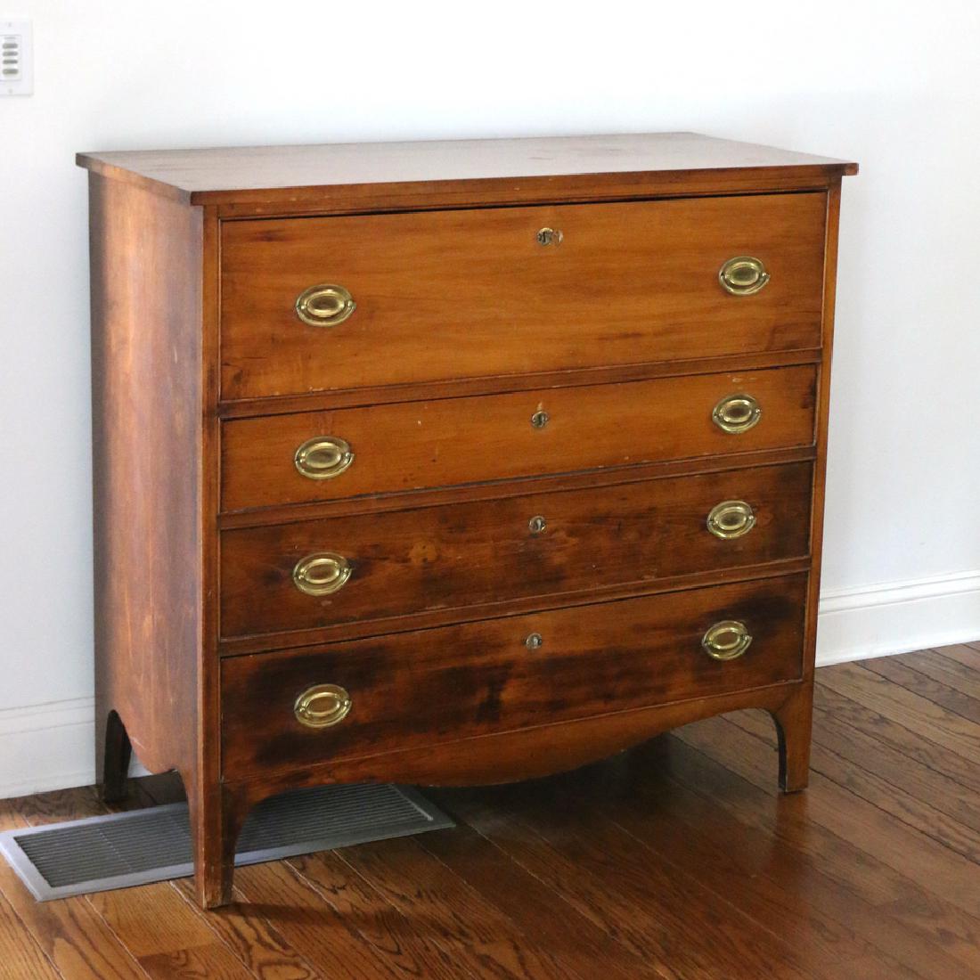 AMERICAN CHERRY HEPPLEWHITE CHEST: Having four graduated drawers on bracket feet, original pulls