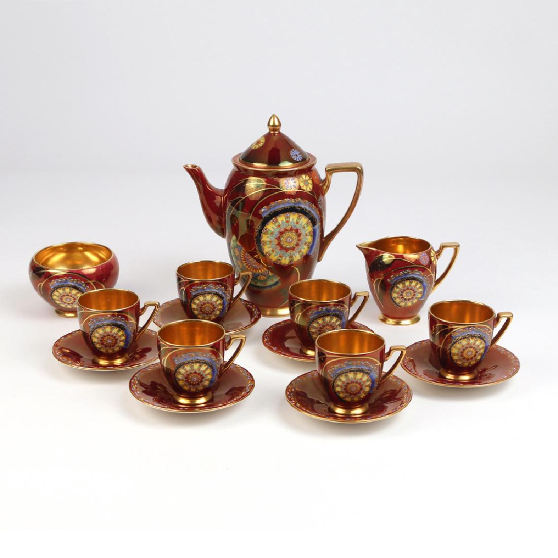 (15pc) CARLTON WARE TEA SET: having an Art Deco asian-inspired design on red, consisting of teapot, creamer, sugar, 6 cups, and 6 saucers h. 8 in. (tea pot) Condition: one cup with large split
