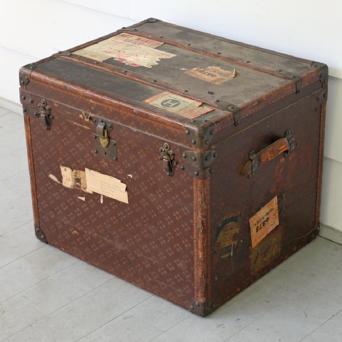 AUX ETATS UNIS STORAGE TRUNK: Marked 299 Rue St. Honore" h. 20 w. 24 d. 20"