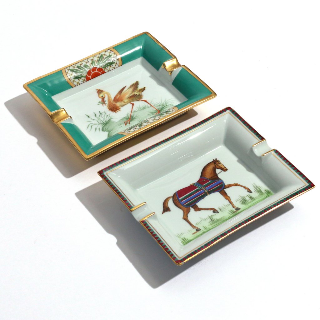 (2pc) HERMES PORCELAIN ASH TRAYS: including one with a horse and one with a bird, both signed h. 6-1/4 w. 7-1/2 in.