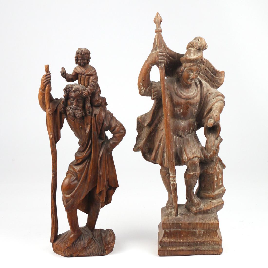 (2pc) ANTIQUE CONTINENTAL CARVINGS: 19th Century or earlier, including an allegorical carving with a Roman soldier holding a flag resting on a house, with label of Ludwig Roger, Munich; and a carving of Joseph holding a stick with the C