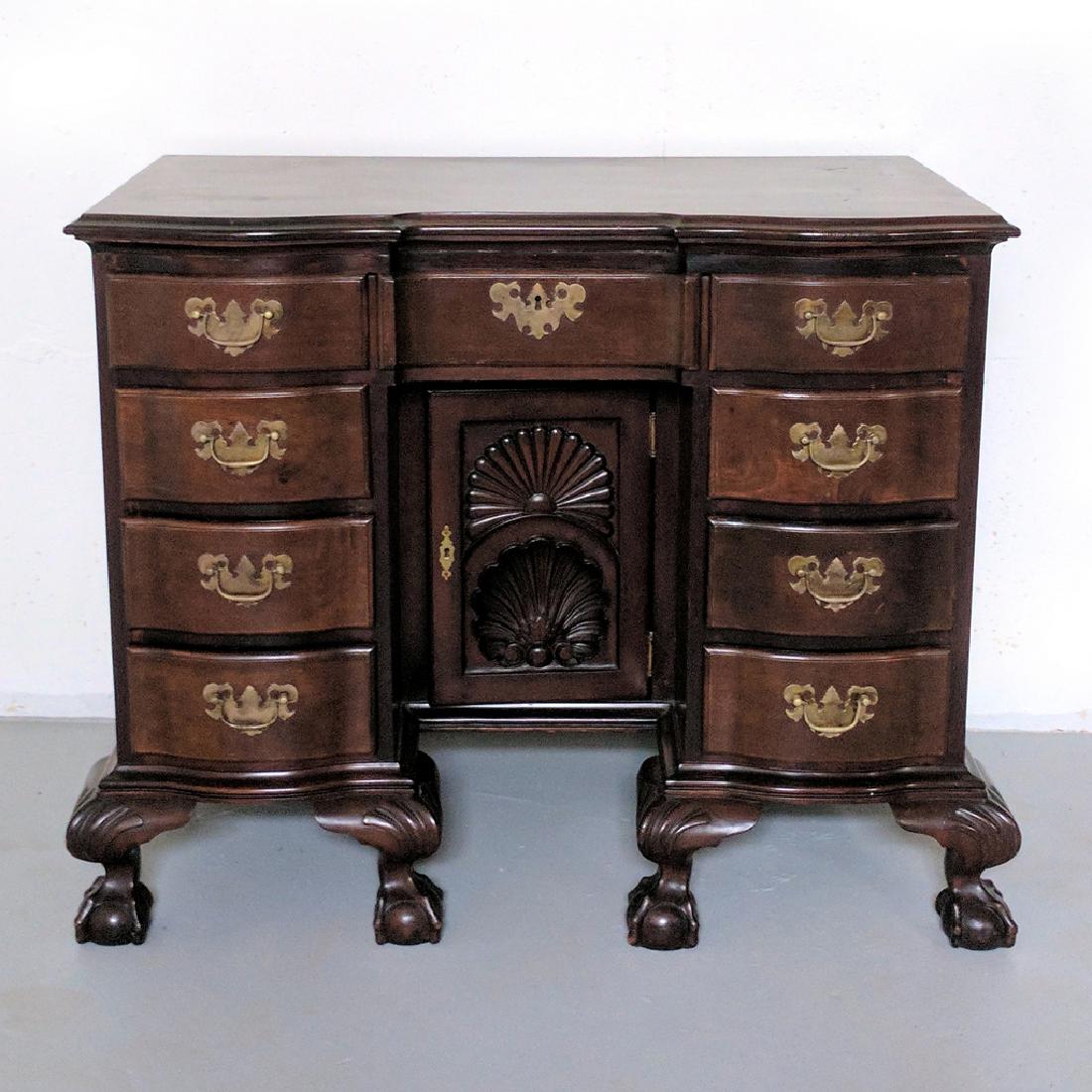 MAHOGANY BLOCK-FRONT KNEEHOLE DRESSING TABLE: late 19th Century, with double shell-carved recessed door front, ball and claw fee AUCTION IN SITU ITEM: Please note this is available to view by appointment as it is stored externally to the saleroom