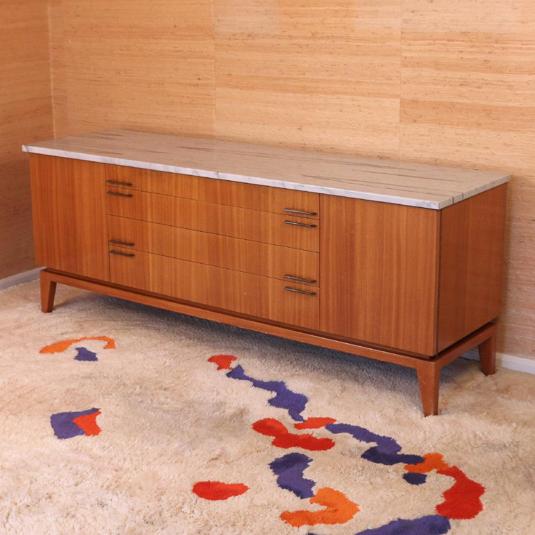 (ATTRIB) JOSEPH ARONSON INC. WALNUT SIDEBOARD: circa 1952, in the style of Edward Wormley, probably made by Josef Aronson (see lot 164), with white marble top, drawers with fitted cutlery inserts, and pressure-release side cabinet doors h. 30-1/2 
