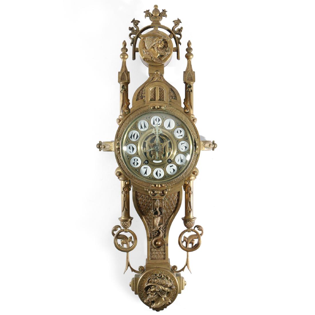 UNUSUAL CONTINENTAL BRONZE CARTEL CLOCK: late 19th Century, probably Belgian or French, decorated in the Spanish taste with dragons, lizards, spires and other gothic devices, and with profiles of Spanish soldiers, the back with a goblin, tom