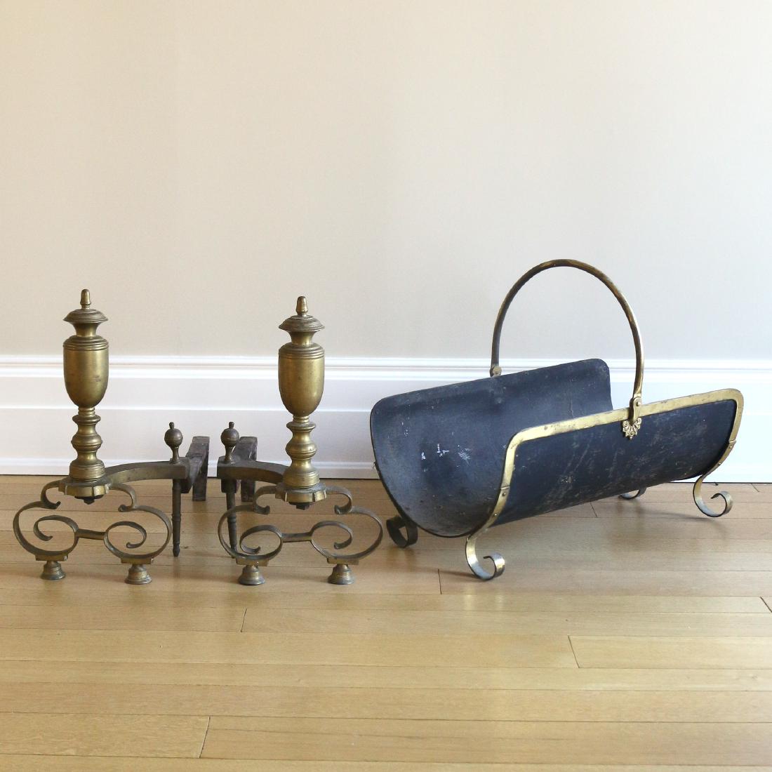 (3pc) ANTIQUE BRASS ANDIRONS & LOG HOLDER: The andirons with C-scroll bases, h. 18 w. 10 d. 20 in.; the metal log holder with bail handle, h. 19 w. 12-1/2 d. 22 in.
