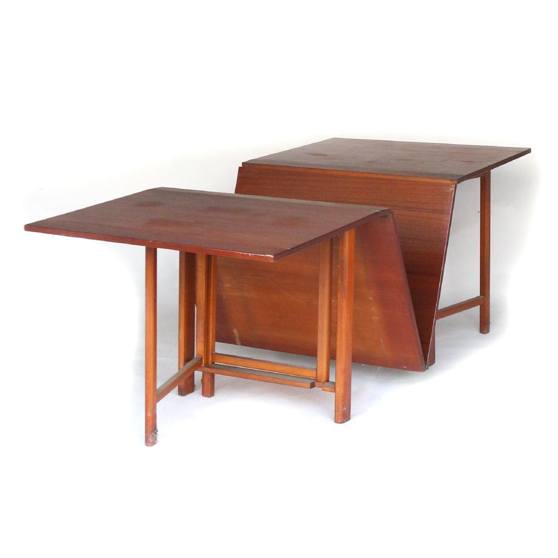 STYLE OF BRUNO MATTHSON DINING TABLE: A 'Maria' style drop leaf table with four 26 inch leaves; marked "MADE IN SWEDEN" h. 29 w. 35-1/2 d. 8 in. Condition: Rings and other marks to top, some areas of age splits and scuffing, otherwise app