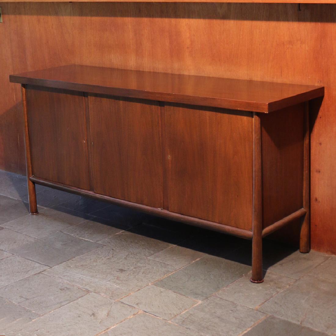 T.H. ROBSJOHN GIBBINGS / WIDDICOMB SIDEBOARD: walnut veneer, having three cabinet doors, unmarked h. 34-1/2 w. 72 d. 20 in. Condition: missing two drawers, stiff right door, scuff on top