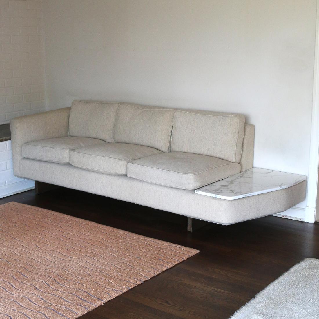 MID-CENTURY CUSTOM 3-CUSHION SETTEE: with cantilevered marble shelf and teak legs h. 27 w. 91 d. 34 in. Condition: upholstery in very good condition