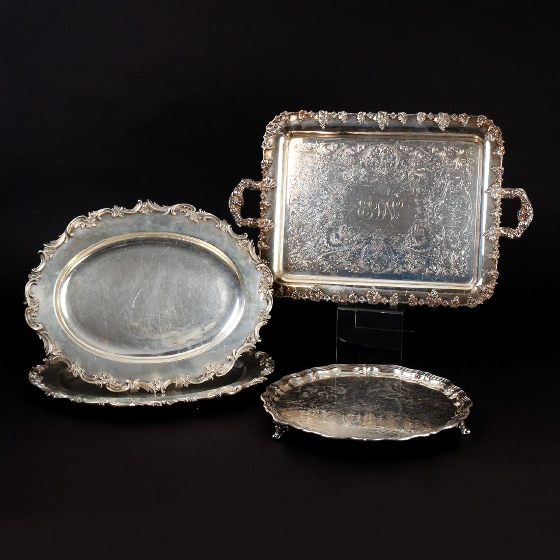 (4pc) SHEFFIELD PLATE TRAYS: including a rectangular tray with double handles and grape design, monogrammed; a pair of oval platters with finely chased borders, having crossed keys marks; and a James Dixon & Sons shaped footed tr