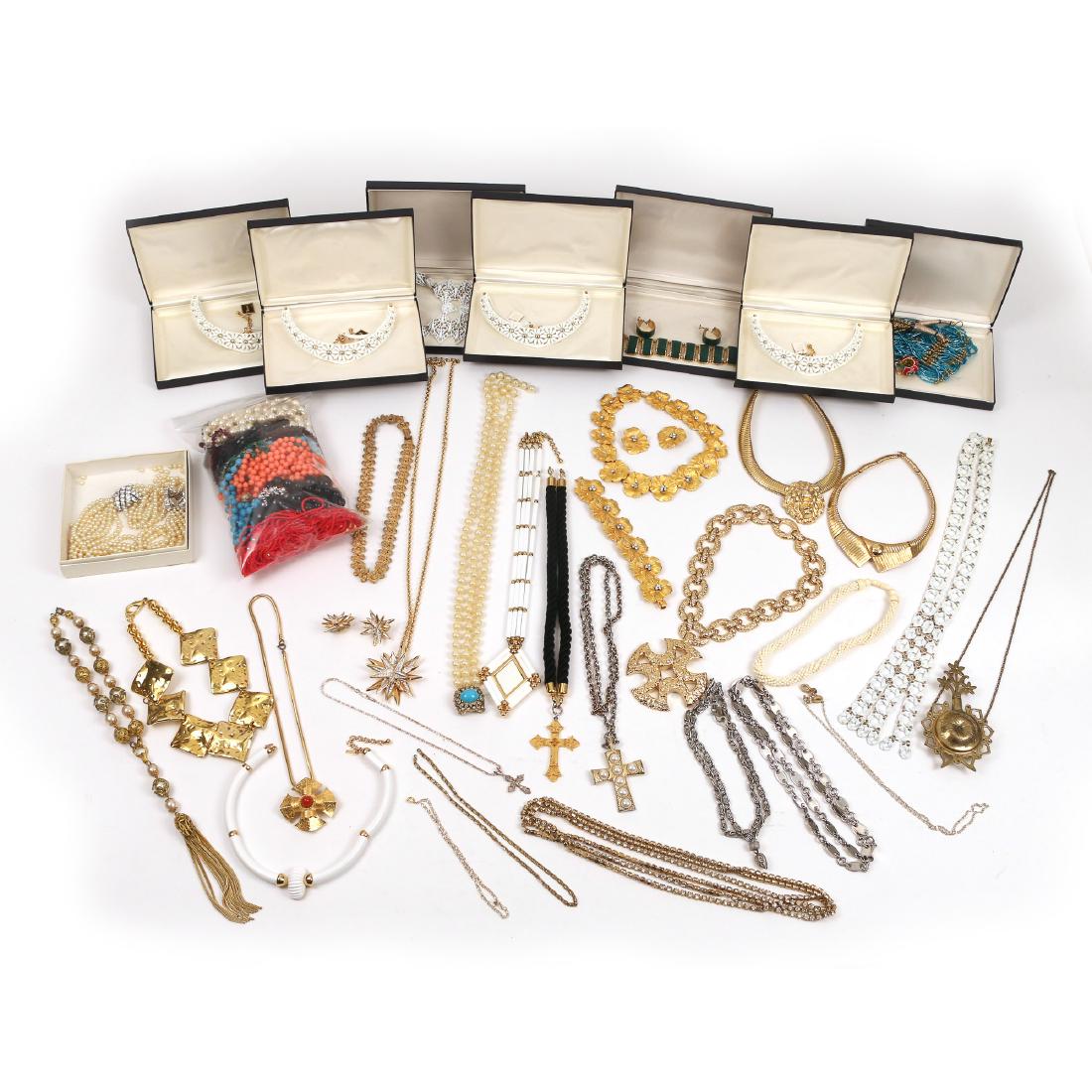 COSTUME JEWELRY MOSTLY NECKLACES: Including a faux gold and rhinestone flower form bracelet and matching necklace, Ciner, Napier, Gay Boyer, Monet, Guy LaRoche, etc.