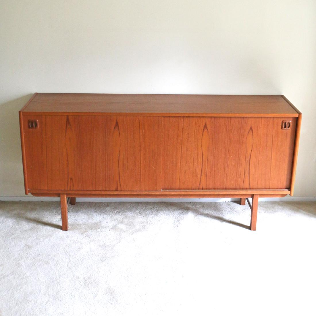 MID CENTURY MODERN CREDENZA: in the style of Hvidt and Molgaard Nielsen, with butterfly-matched veneers, sliding doors h. 30 w. 63 d. 16-1/2 in.