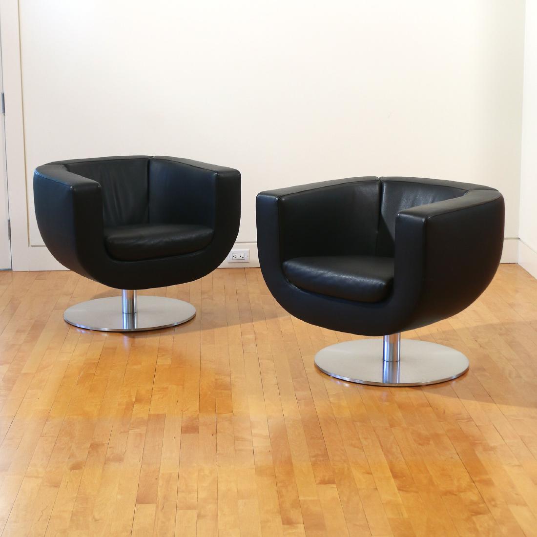 PAIR JEFFREY BERNETT TULIP SWIVEL CHAIRS: B&B Italia, Italy, manufactured in 2002, covered in black leather h. 27 w. 32 d. 29 in. excellent; a few very light scuffs