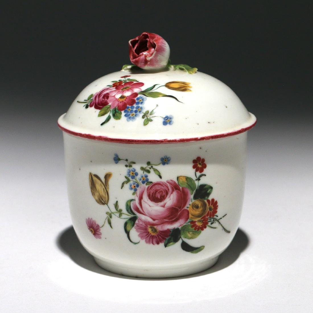 MENNECY PORCELAIN COVERED JAR: 18th Century, decorated with floral bouquets, the lid with a rose finial, with 'D.V.' mark h. 4-1/2 in. Provenance: Estate of John F. Ball, Television and Film Production Executive, Greenwich, CT