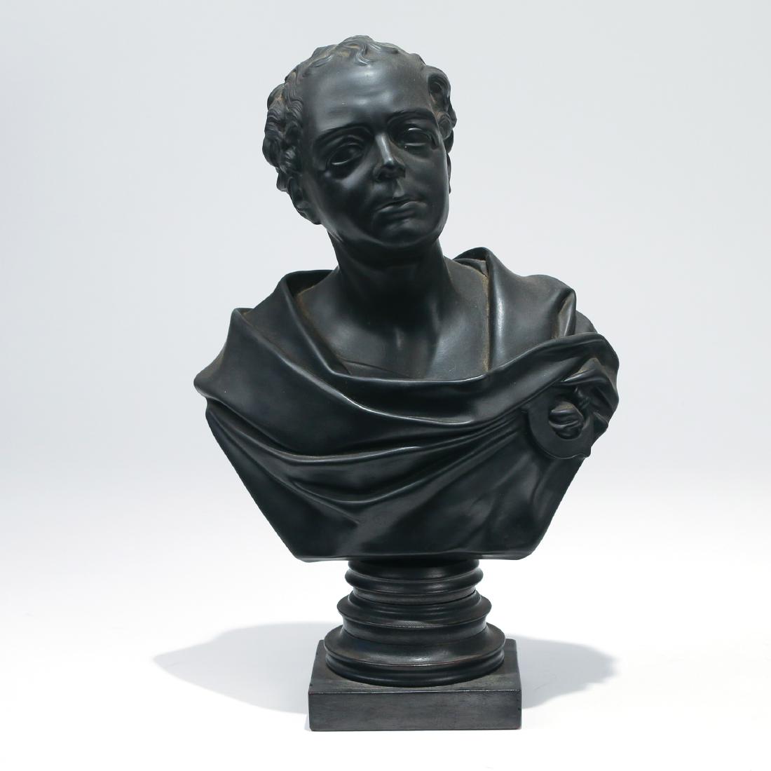 WEDGEWOOD BASALT BUST OF THOMAS MOORE: 19th Century, a bust of the Irish poet Thomas Moore (1779-1852) in a Roman robe, on the original ebonized wood plinth, stamped 'Wedgewood' h. 14-1/4 in. Provenance: Descent through the family of the l