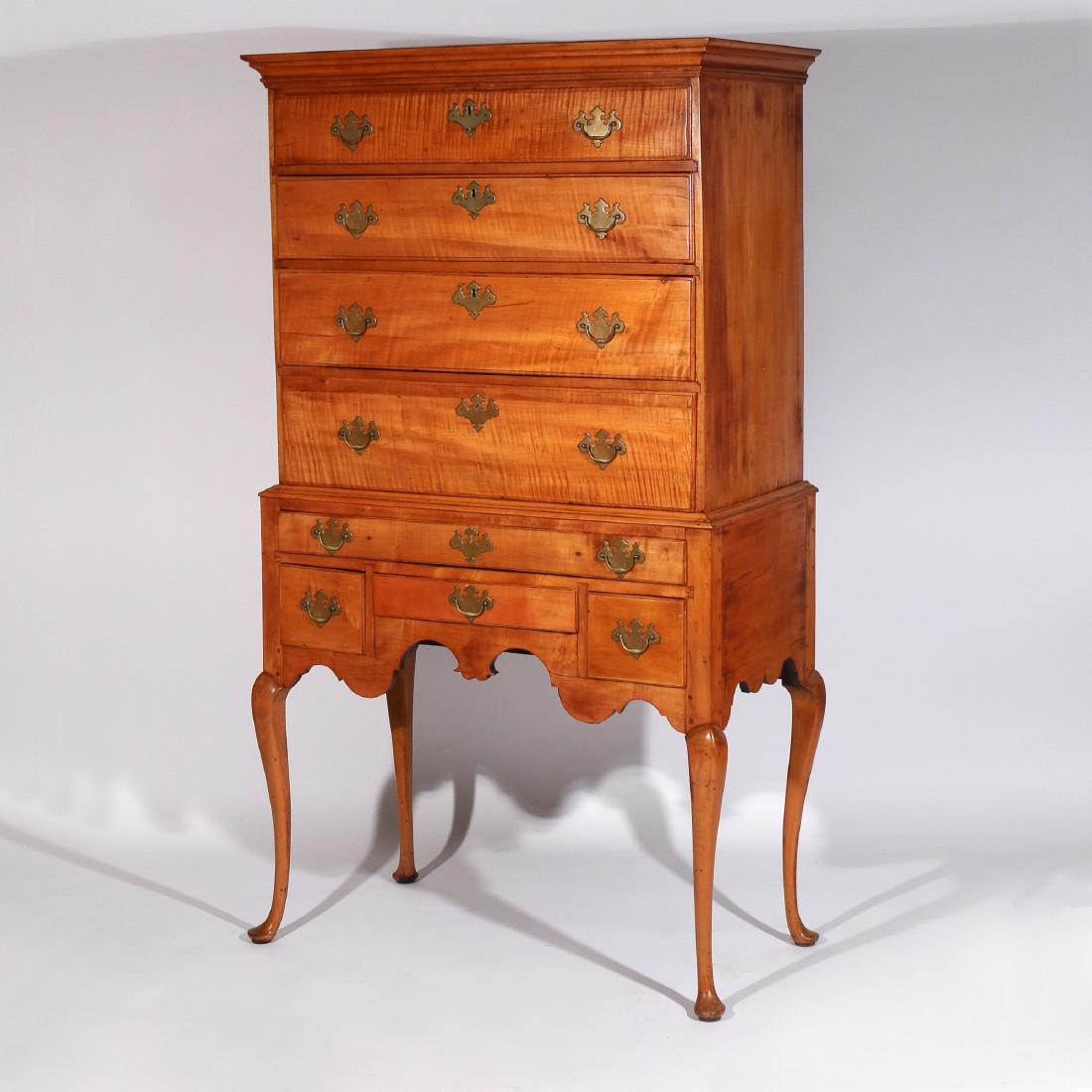 AMERICAN CHIPPENDALE MAPLE HIGHBOY: mid 18th Century, the cornice over four graduated drawers and a lower case with a shaped apron and cabriole legs h. 65-1/2 w. 37 d. 20 in. with restorations