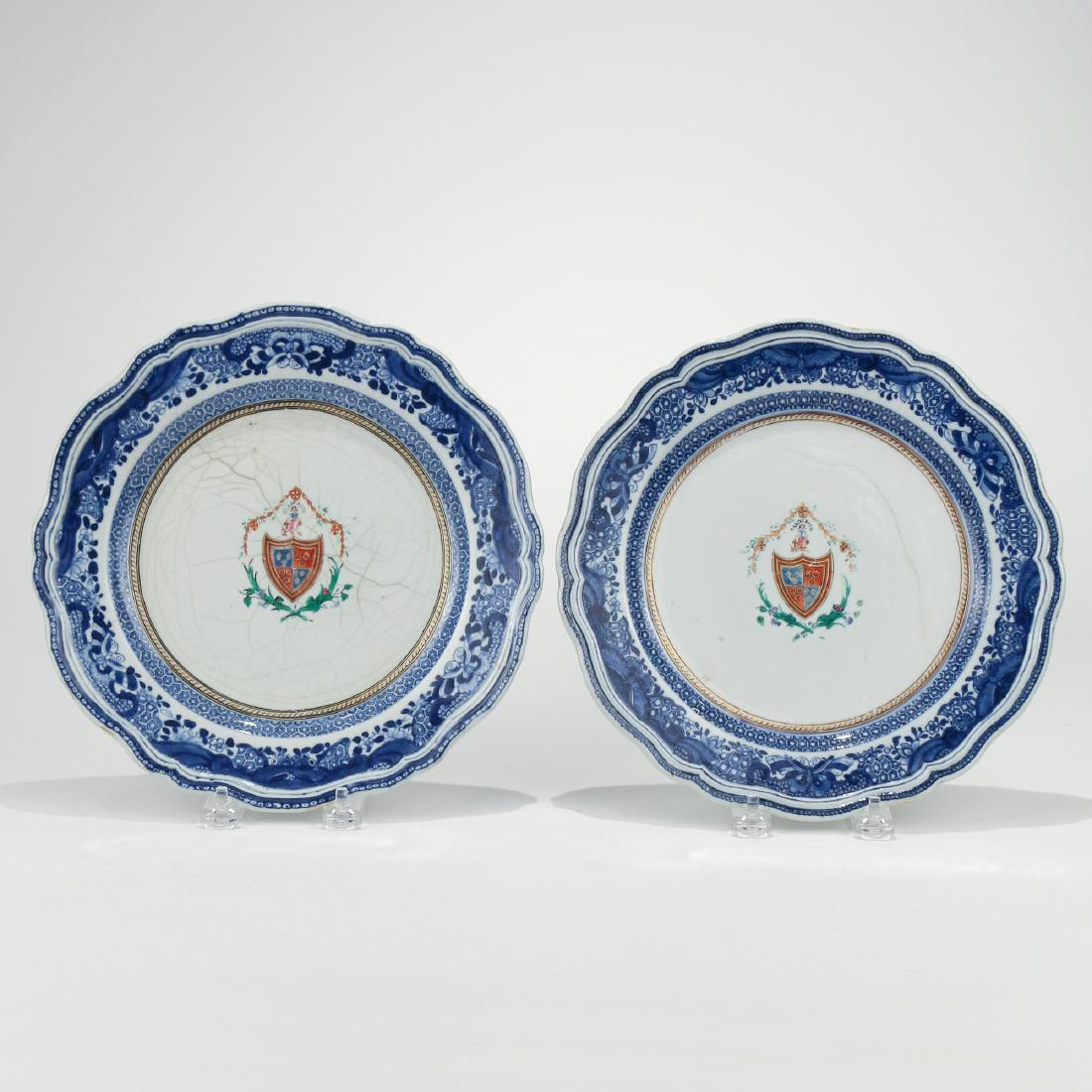 PAIR CHINESE EXPORT ARMORIAL PORCELAIN DISHES: 18th Century, with scallop edges and blue borders enclosing a heraldic device dia. 9-3/4 in. Provenance: Estate of John F. Ball, Television and Film Production Executive, Greenwich, CT
