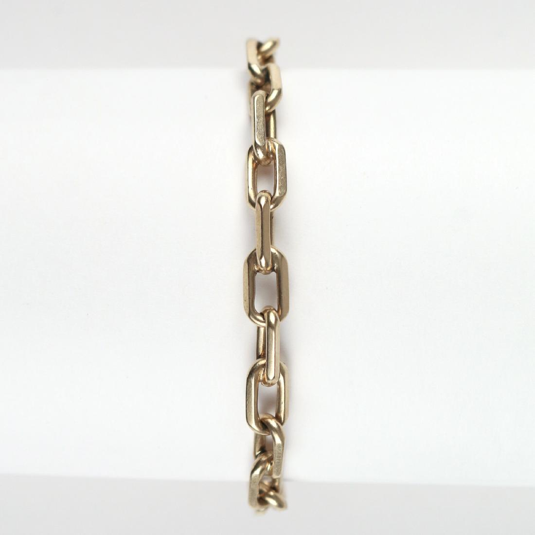 TIFFANY & Co. 14k GOLD BRACELET: Designed as a heavy squared link chain, 7-1/2 in., 18.1g, marked "14k / Tiffany" Provenance: From the Estate of Anita V. Behnken, Norwalk, CT; volunteer and creator of the Norwalk Symphony Endowment F