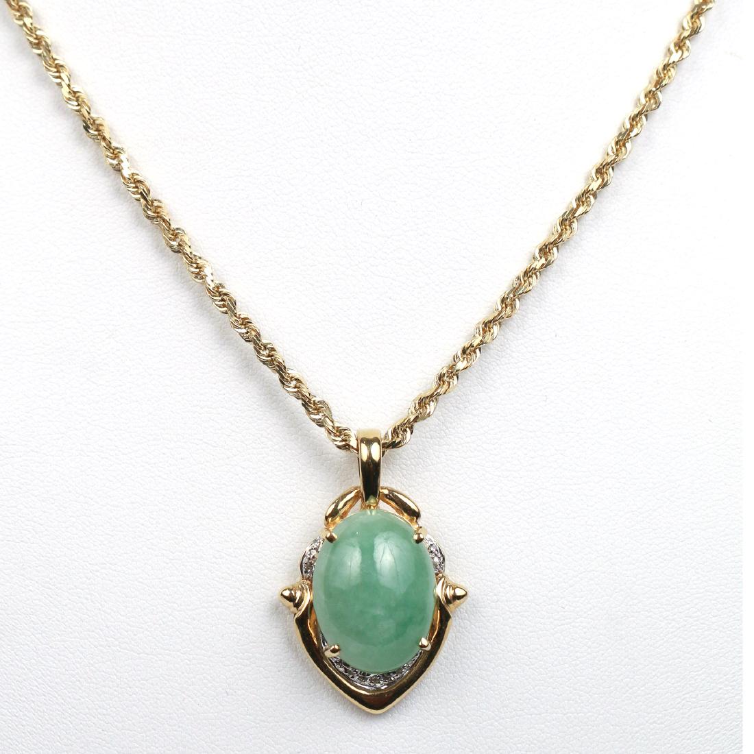 GREEN JADE, DIAMOND & GOLD PENDANT: Designed as a pale green jade cabochon (20 x 15mm), embellished with platinum-set melee diamonds in a 14k gold escutcheon form surround suspended from a 14k gold twisted rope form chain; chain 19 in.,