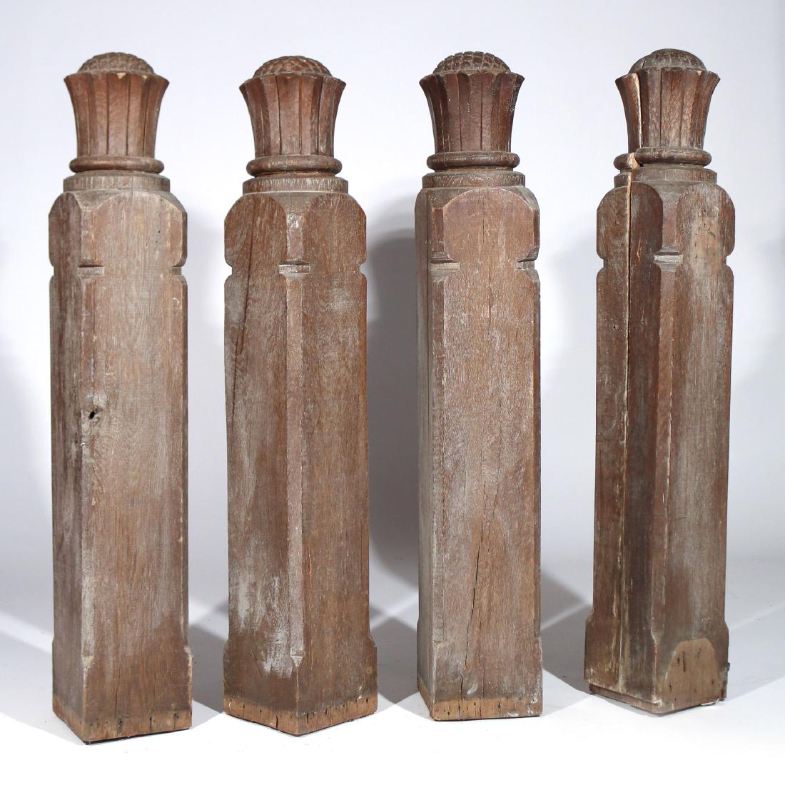 (4pc) ANTIQUE CARVED OAK NEWEL POSTS: 19th Century, each with sunflower-form finials h. 44 w. 7 d. 7 in.