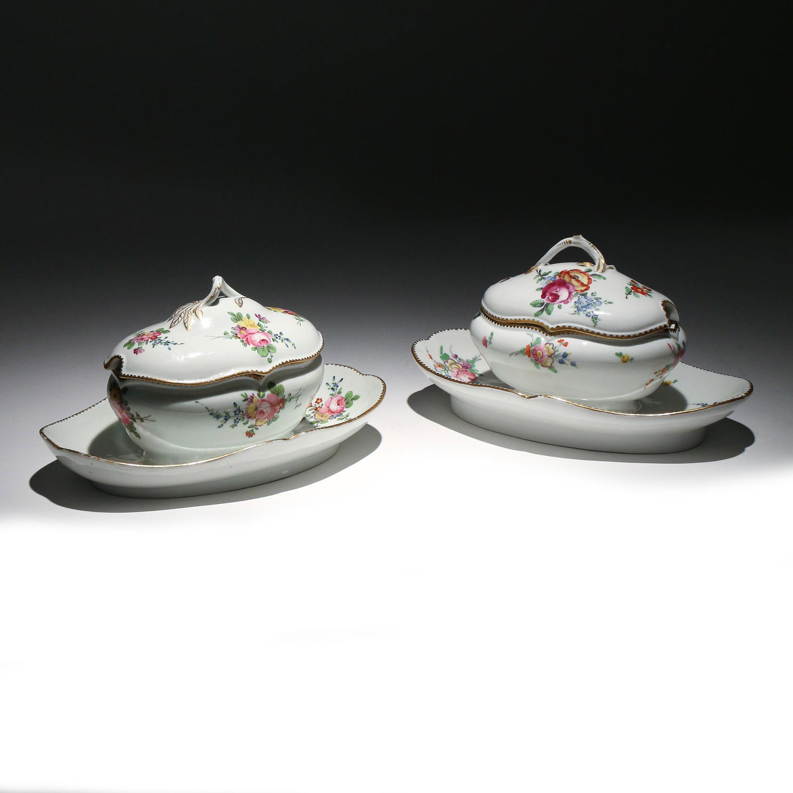 NEAR PAIR PORCELAINE DE LA REINE SAUCE BOATS: Late 18th Century, Paris, (Leboeuf, rue Thiroux), Queen’s factory made under the patronage of Marie Antoinette, with crown-over-A mark in iron red h. 4-3/4 w. 9-1/2 d. 6 in. Provenance:Estate of Joh