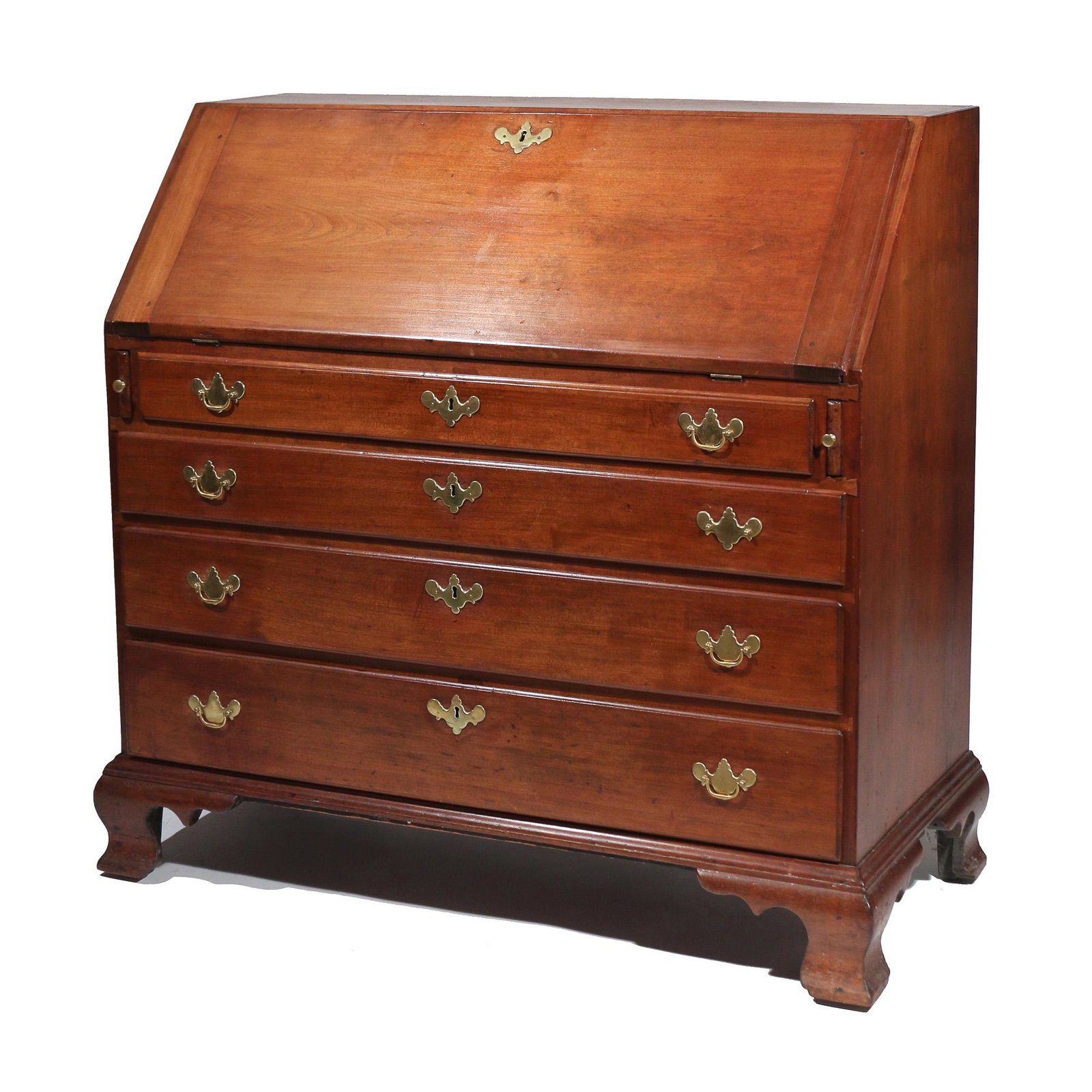 AMERICAN CHIPPENDALE CHERRYWOOD SLANT LID DESK: late 18th/early 19th Century, with four graduated drawers over ogee bracket feet, orig brasses h. 41 w. 44 d. 20-1/2 in. Provenance:Descent through the family