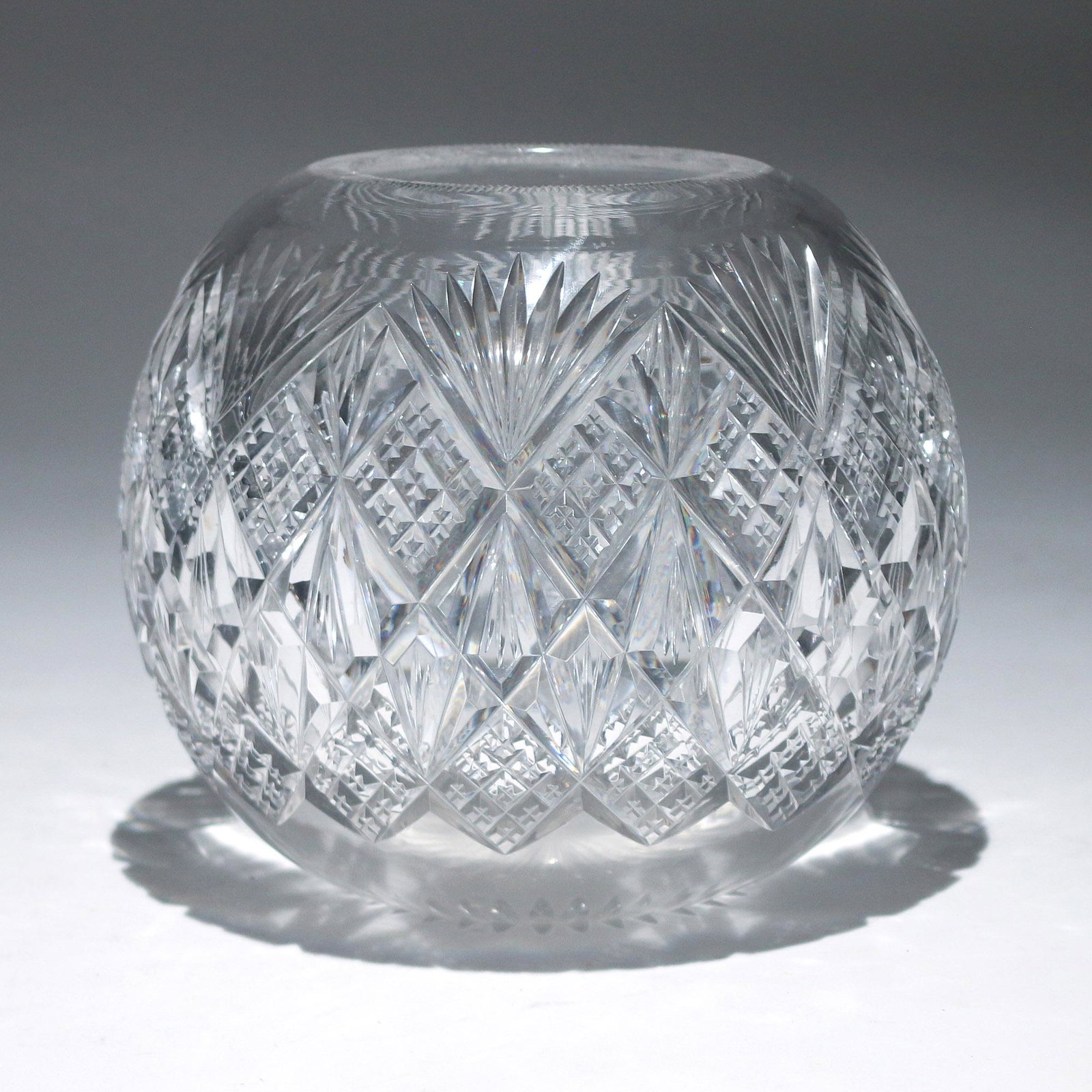 CUT CRYSTAL ROSE VASE: of spherical shape, no apparent marks h. 7-1/2 dia. 8-1/2 in.